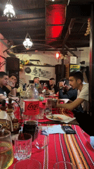 Evening dining gathering at traditional Bulgarian restaurant in Varna