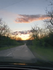 Driver captures sunset journey on damaged Ukrainian road