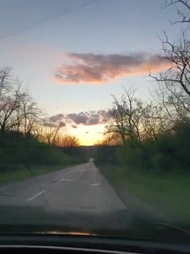 Driver captures sunset journey on damaged Ukrainian road