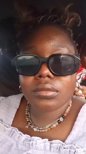 Person in sunglasses observed in vehicle in Alasia, Nigeria