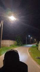 Routine nighttime street activity captured across residential area