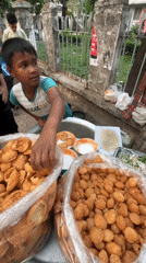 Young vendor serves pani puri at Dhaka street stall