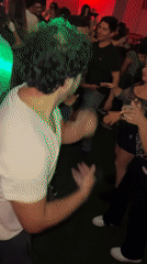Young adults dance at crowded nightclub in Arica, Chile