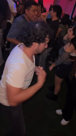 Young adults dance at crowded nightclub in Arica, Chile
