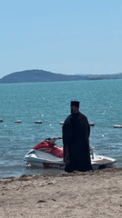 Orthodox priest performs blessing ritual on Bulgarian beach