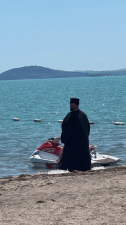 Orthodox priest performs blessing ritual on Bulgarian beach