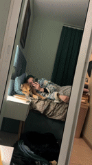 Woman and dog rest together on furniture in Bulgaria