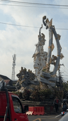 Ornate Hindu statue documented at Ubud street intersection