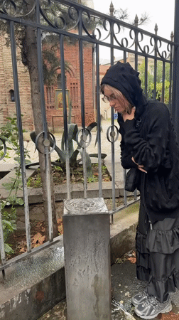Stopping for a drink at a Tbilisi street fountain