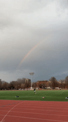 Rainbow appears over New York track field after rain
