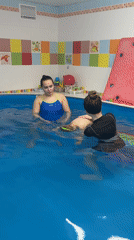 Child's swimming lesson at an indoor pool