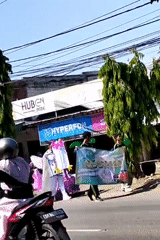 Street parade winds through Kediri City with costumes and crowds