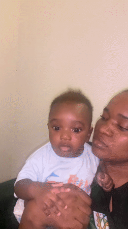 Woman kisses baby in tender moment in Nigeria