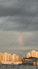 Rainbow breaks through cloudy skies over Yekaterinburg