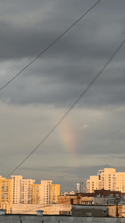 Rainbow breaks through cloudy skies over Yekaterinburg