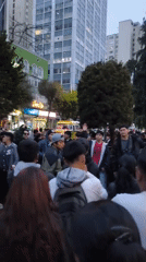 Young people gather outdoors in La Paz evening scene