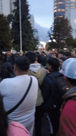 Young people gather outdoors in La Paz evening scene