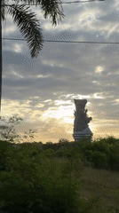 Statue filmed against cloudy sky in Kuta Selatan