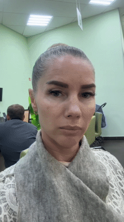 Woman films selfie video in Abakan waiting room