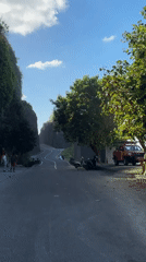 Riding the cliff road down to the Kuta Selatan coast