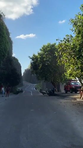 Riding the cliff road down to the Kuta Selatan coast