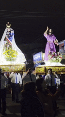 Nighttime religious procession through Iquique streets