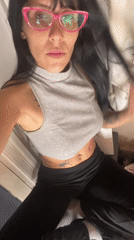 Tattooed individual in pink glasses observed in Buenos Aires