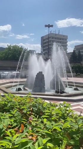 Fountain operates in Blagoevgrad public square on sunny morning