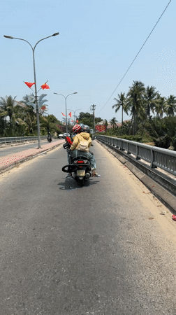 Two motorcyclists spotted on road in Đà Nẵng, Vietnam