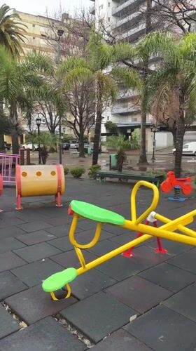 Empty wet playground in Tigre on a grey winter afternoon