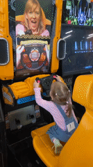 Child plays arcade games at entertainment center in Perm