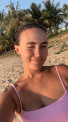 Woman poses for photo on Phu Quoc beach