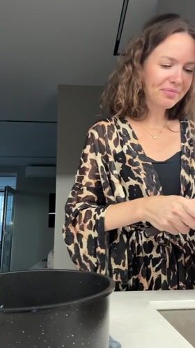 Peeling potatoes in a Khimki kitchen, leopard robe on