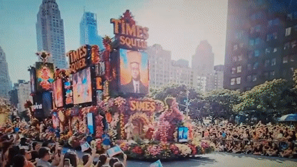 Decorated float and rifle formation at a Times Square parade