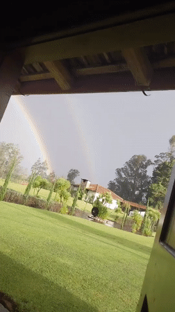 Double Rainbow Appears Over La Merced Ecuador Residential Area