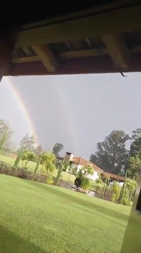 Double Rainbow Appears Over La Merced Ecuador Residential Area