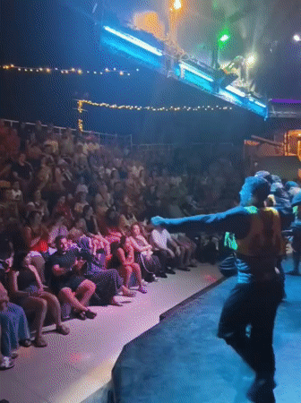 Outdoor stage performance lights up a summer evening in Kuşadası