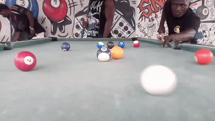 Men play pool in Akwanga, Nigeria
