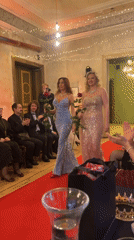 Fashion show with evening gowns and roses in Riga