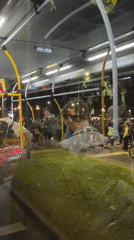 Large crowd crosses Buenos Aires street at night
