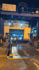 Ferry operations and evening activities at Koh Phangan terminal