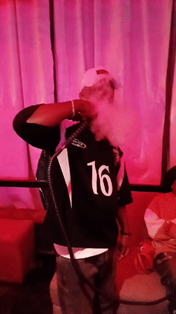 Evening Social Gathering at Nigerian Bar Features Dancing, Hookah