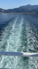 Boat passenger films calm waters near Thassos, Greece