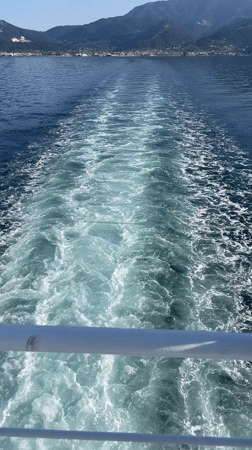 Boat passenger films calm waters near Thassos, Greece