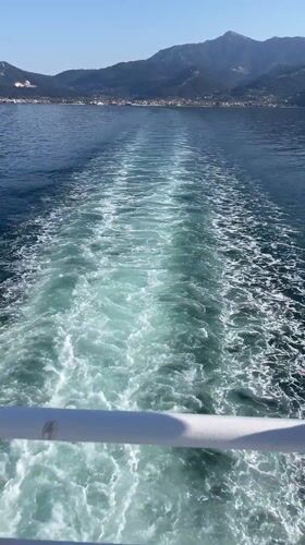 Boat passenger films calm waters near Thassos, Greece