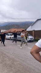 A busy morning across Naryn City, with work and movement in the streets