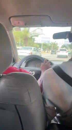 Driver photographed in parked Mazda on Abuja street