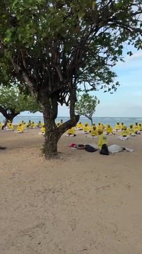 Group meditation session held on Denpasar beach