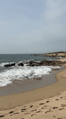 Rocky beach documented under overcast skies in Vila Nova de Gaia