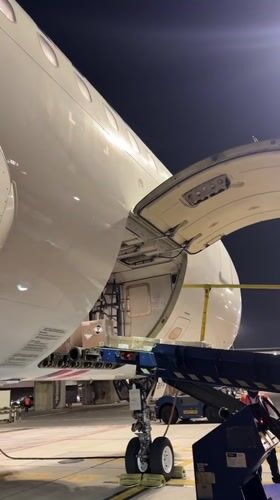 Nighttime cargo operation on the tarmac in Callao, Peru